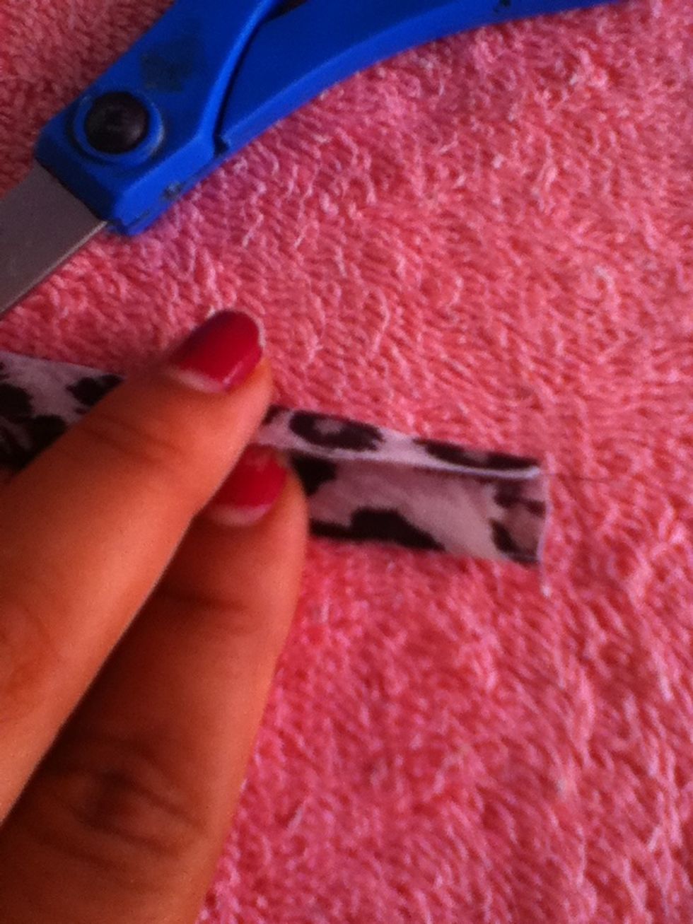 Take the small piece of fabric and fold it length-wise just like you did with the bigger piece.