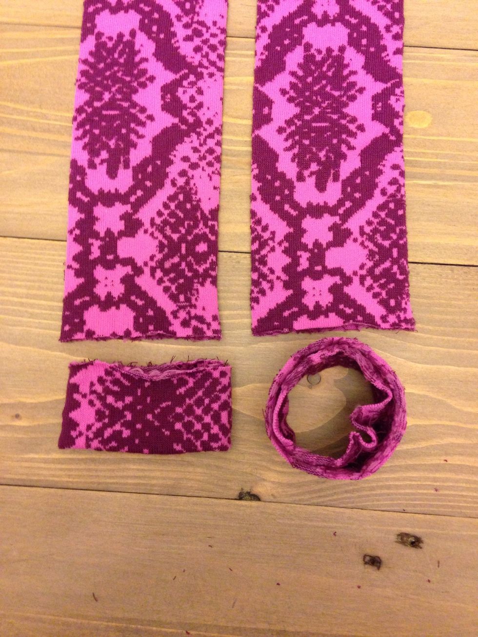 Take the smaller piece and fold it inwards so the insides are touching and it's half the size.