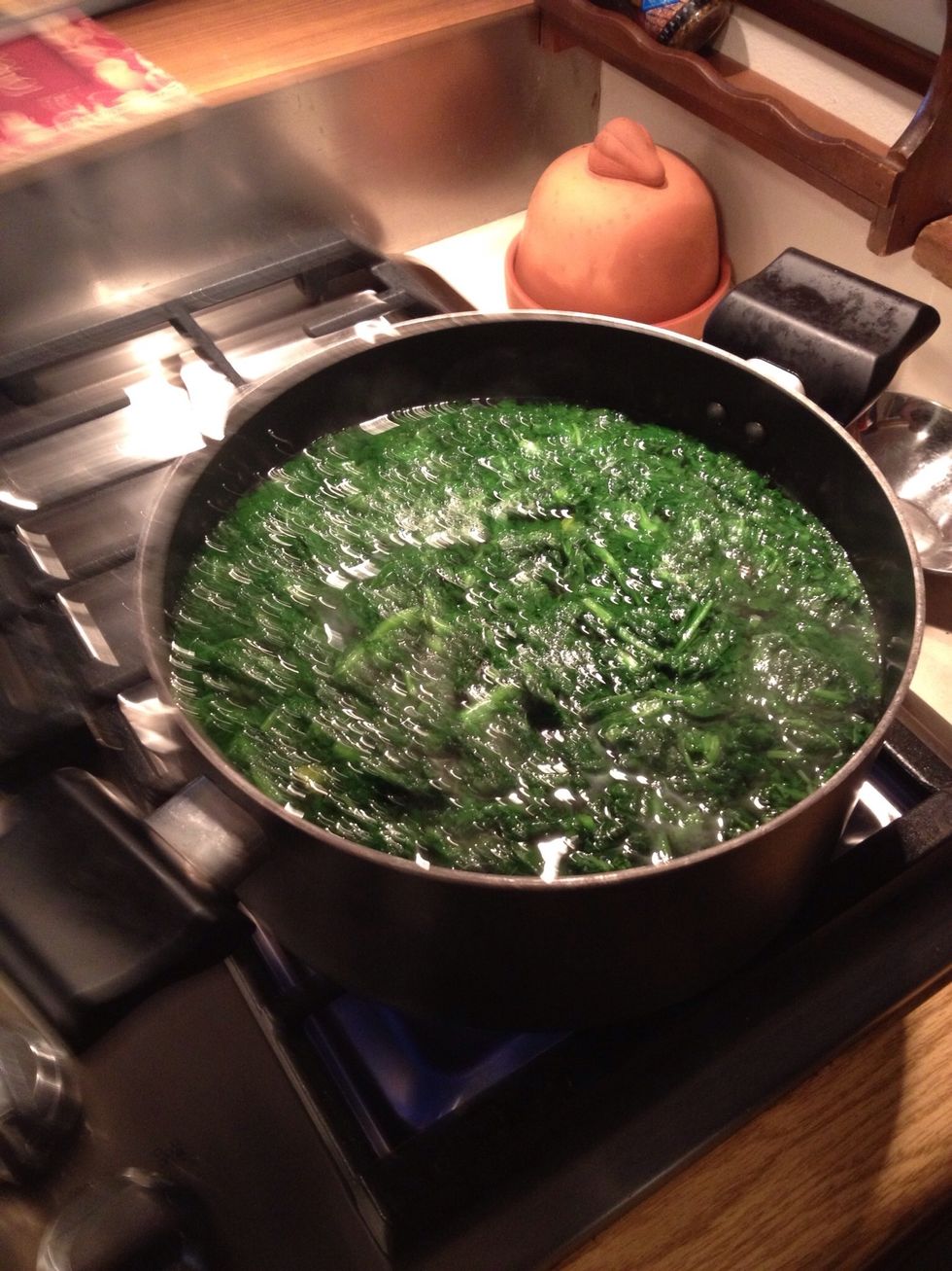 Take the spinach off the stove and strain out the water