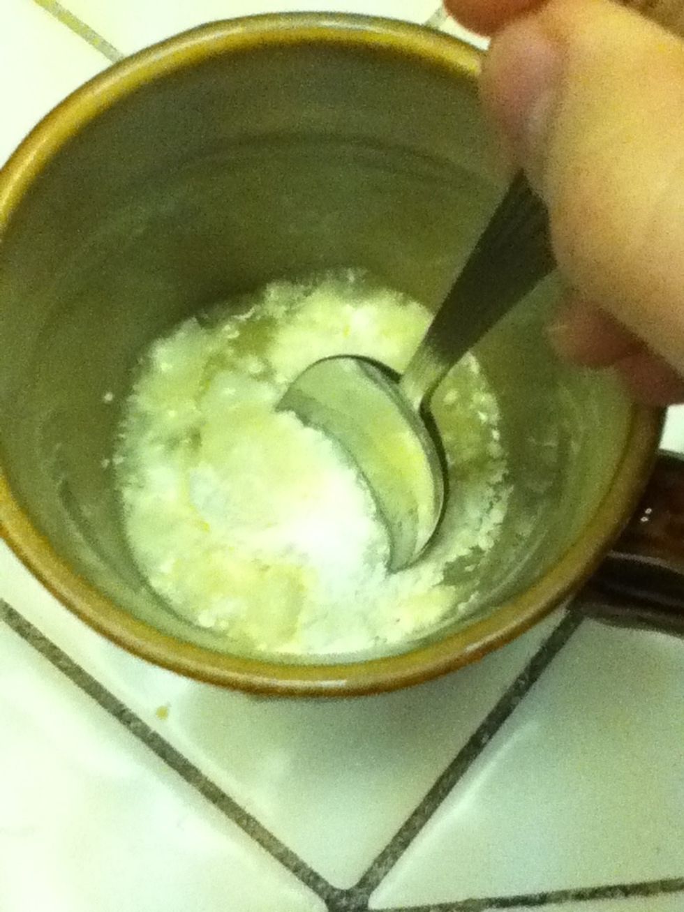 Take the spoon and stir the ingredients. Make sure all of the lumps and dry areas are out. It helps to scrape the bottom and sides a little.