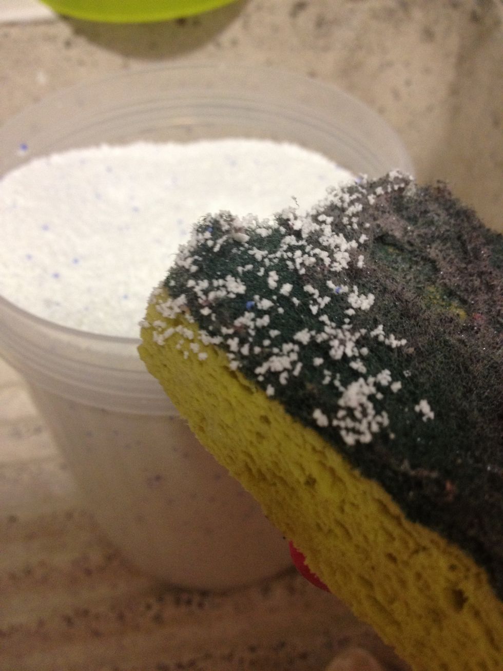 Take the stones out of the dirty water and scrub them with the sponge and powder soap! (I used my old dishes sponge)