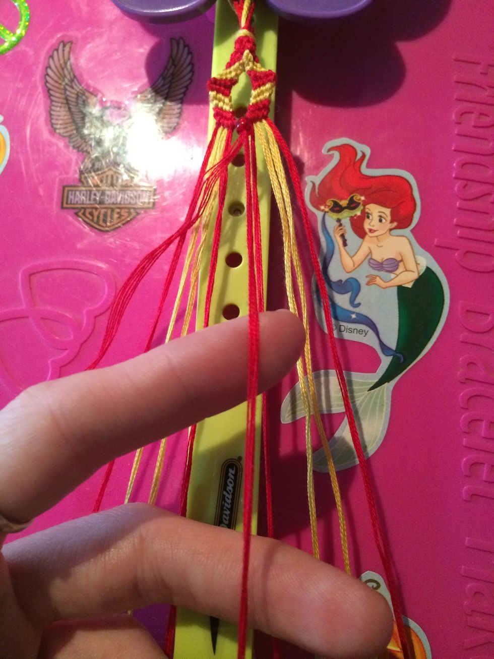 Take the string from the right side and knot the next row. All the knots on this side will be Forwards knots.