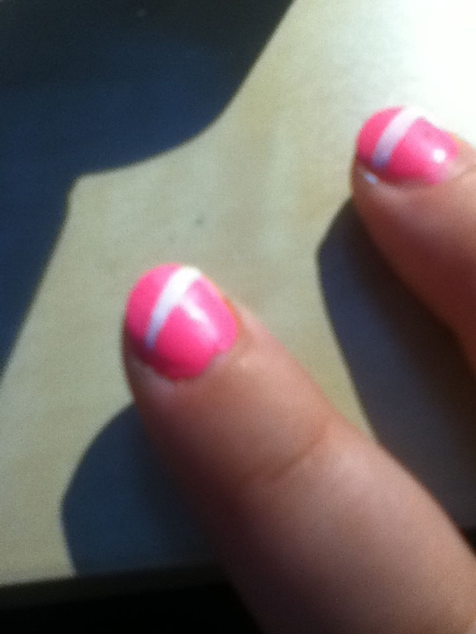 Take the tape off carefully when it's still wet I find this gives it a clearer line remember the top of the stripe doesn't have to be neat right now we fix that later