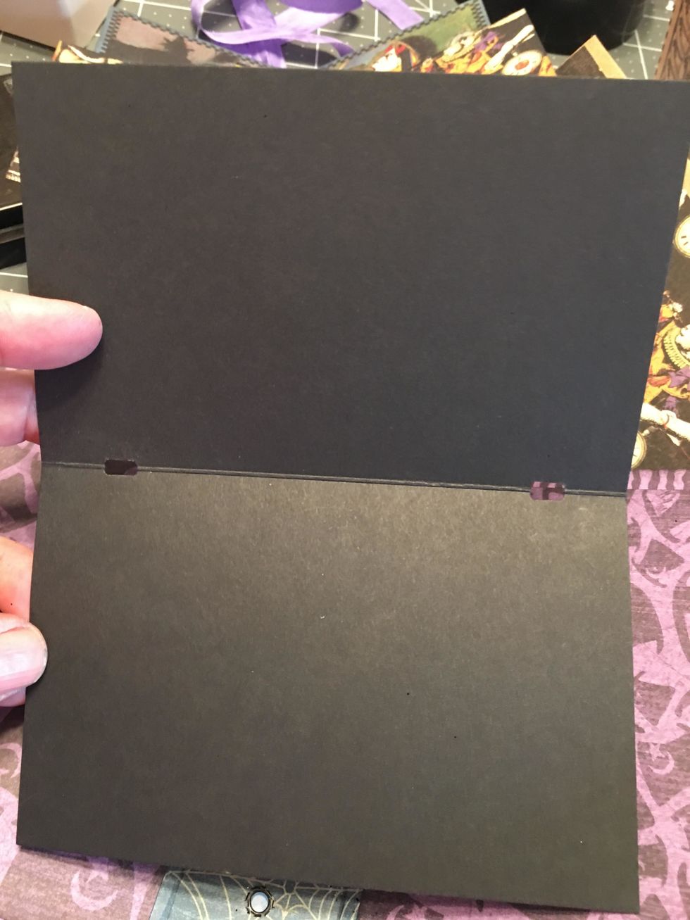 Take the template and lay it folded over a folded page and punch the holes as marked on the template.  The holes should be on the fold line of each page.