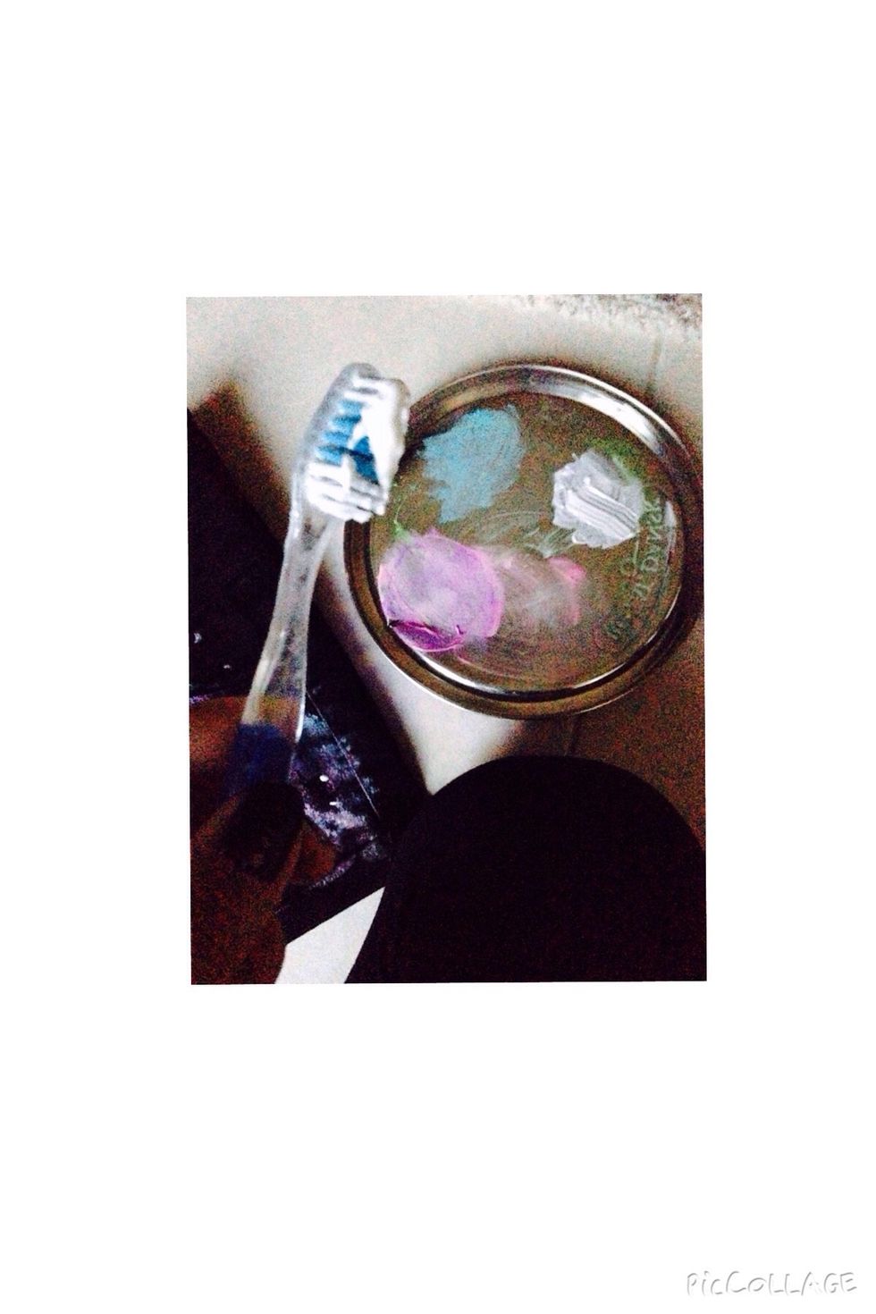 Take the toothbrush and dip it into the white fabric paint.