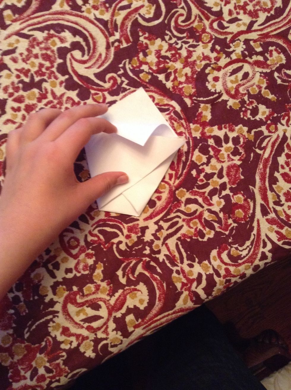 Take the top flat and fold it over like shown.