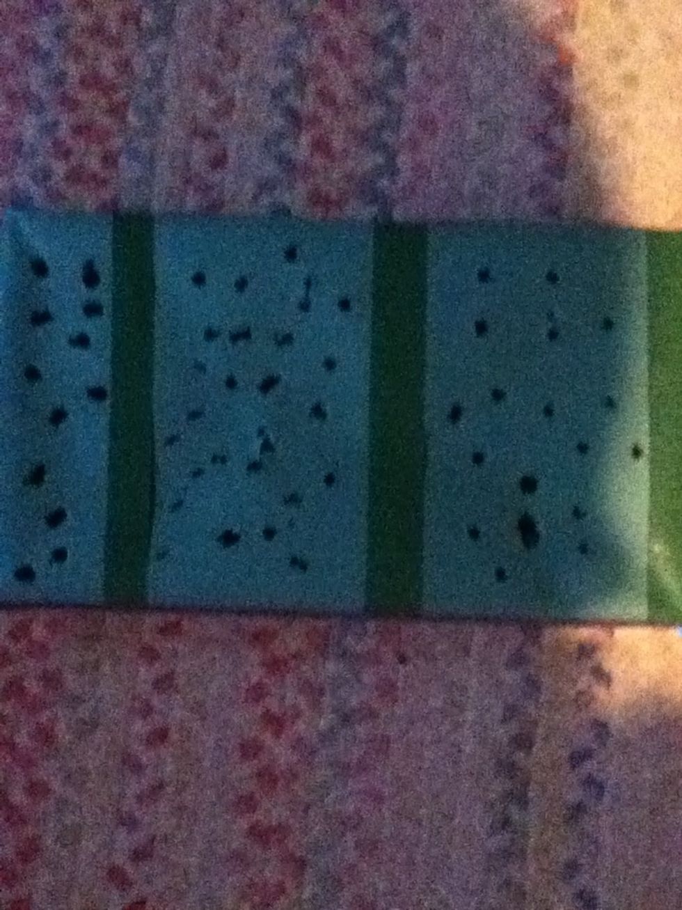 Take the top of the Box off and cover it in paper take your ducted tape and make sections and then make holes in each sections