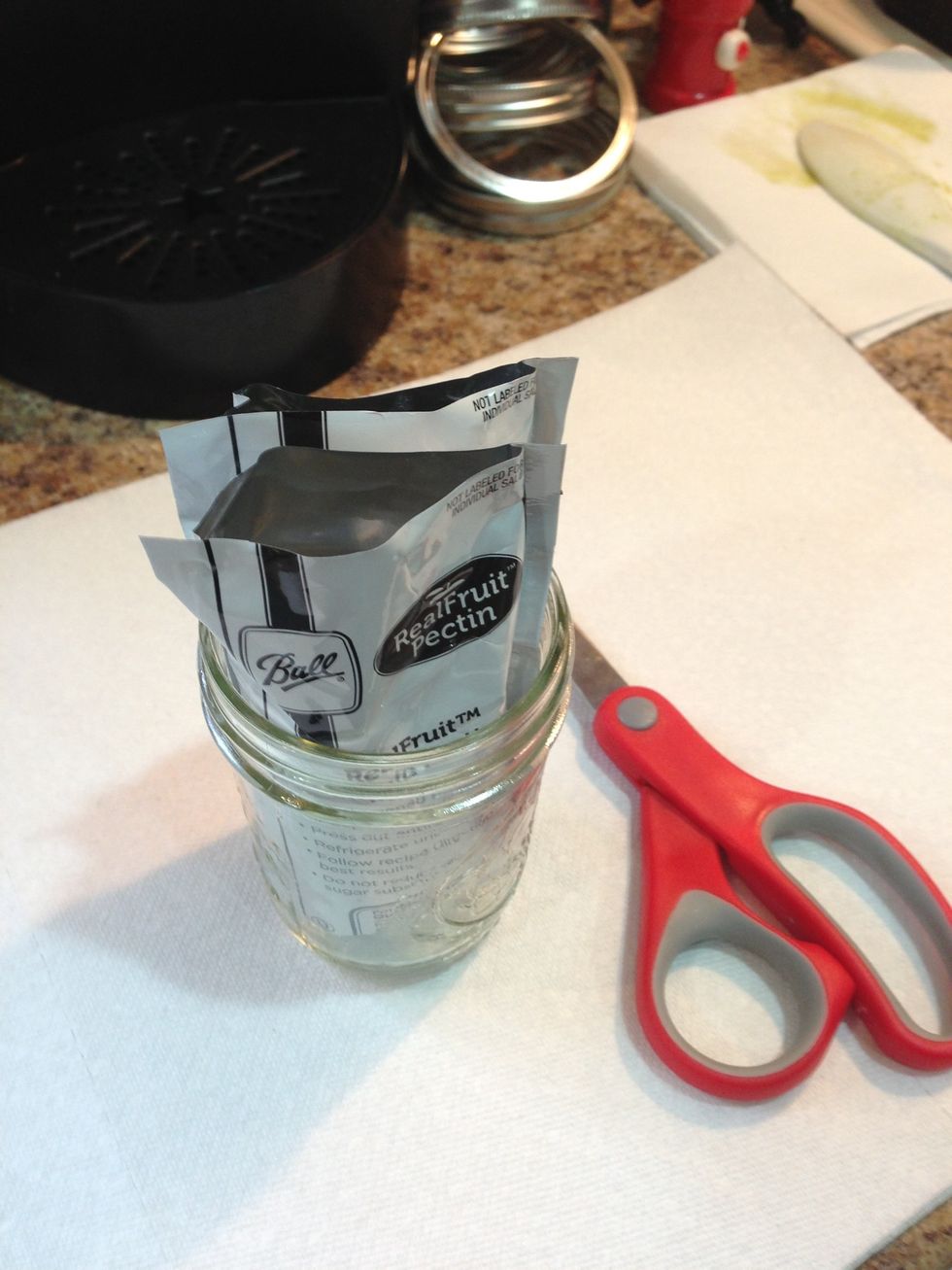 Take the top off the pectin packet use a spare mason jar to hold them upright.