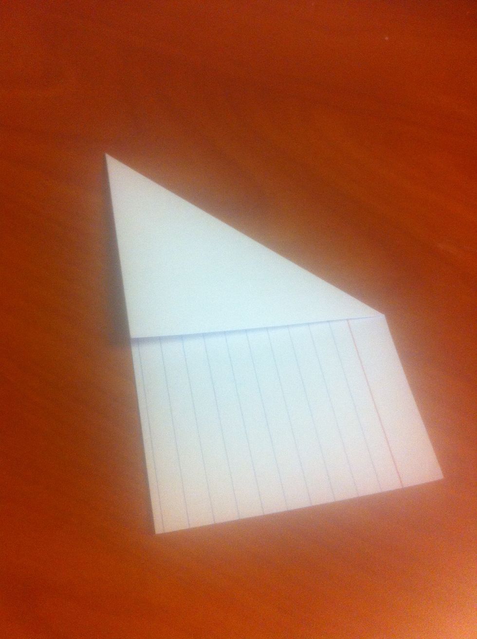 Take the top right corner and fold it down and to the left (as shown). Align the edges of the card to make the best fold possible. Crease the card along the fold.