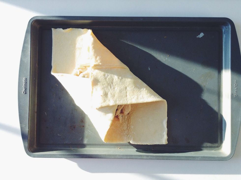 Take the two opposite corners, top and bottom, and fold inward, firmly tap to keep the, together.