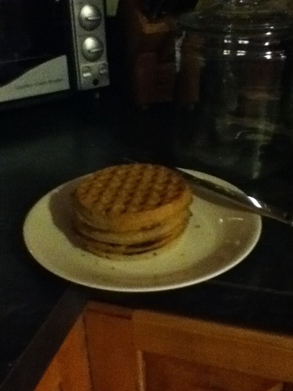 Take the waffles out of the toaster.