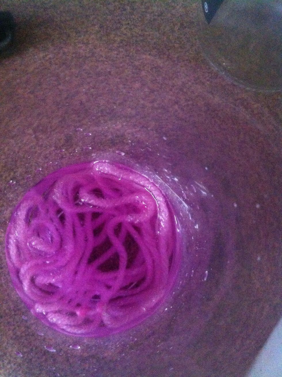 Take the yarn off the bottle, and soak it in the nail polish remover for a couple of minutes