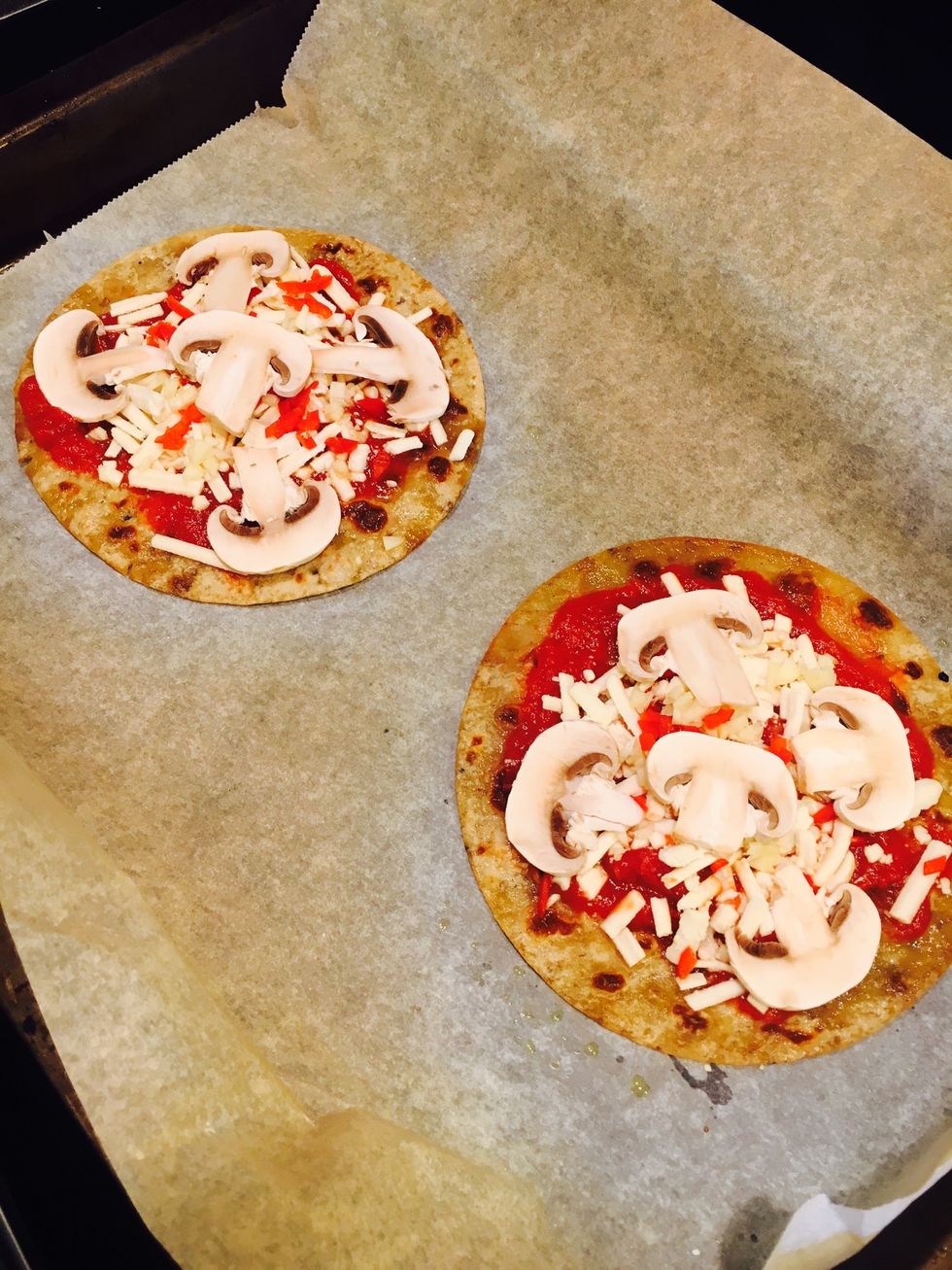 Take them out when they are crispy + have lightly browned. Add the toppings. Heat for another 5 mins until golden.
