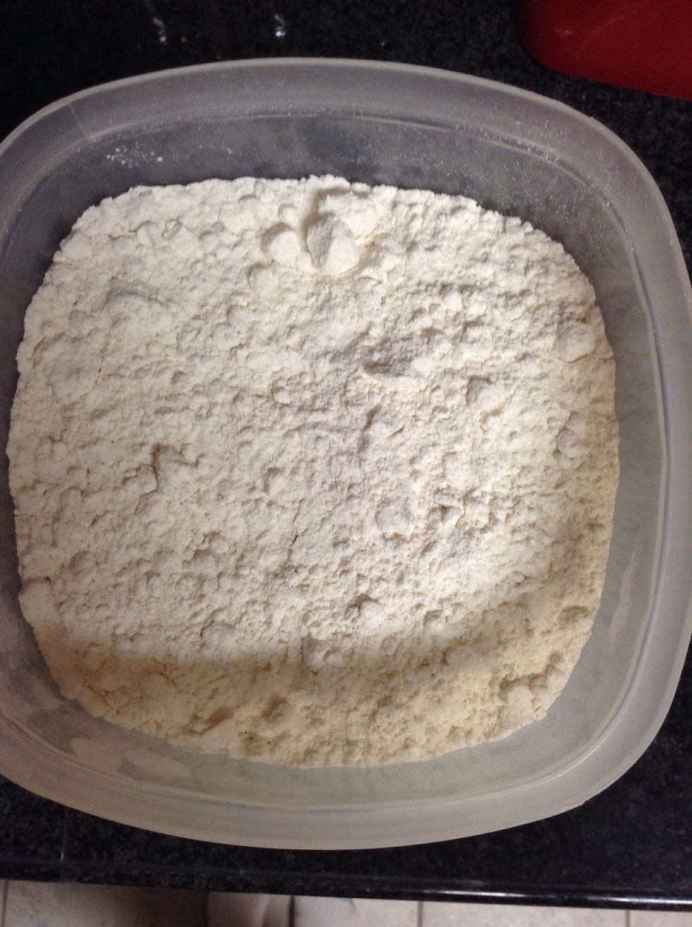Take three cups of flour and put it into a separate bowl.