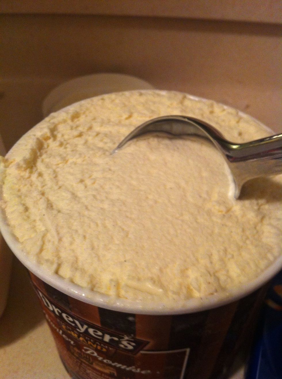 Take three scoops of vanilla ice cream and place them in your blender or other mixing device.