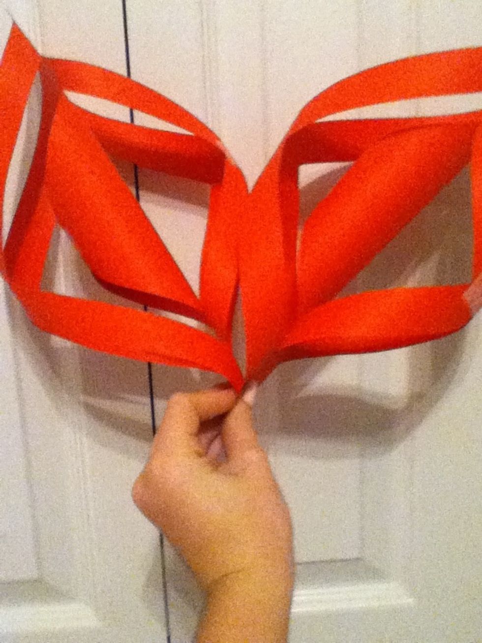 Take two and staple them together where the two parts meet at the bottom and where the two taped pieces come together.
