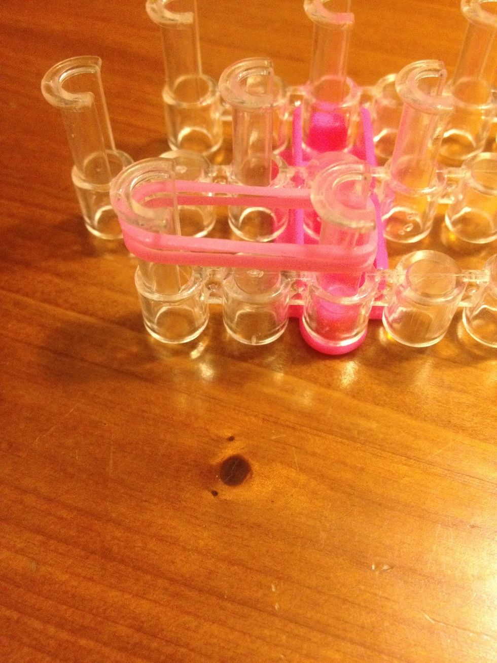 Take two bands and Loop it from first pin to the second