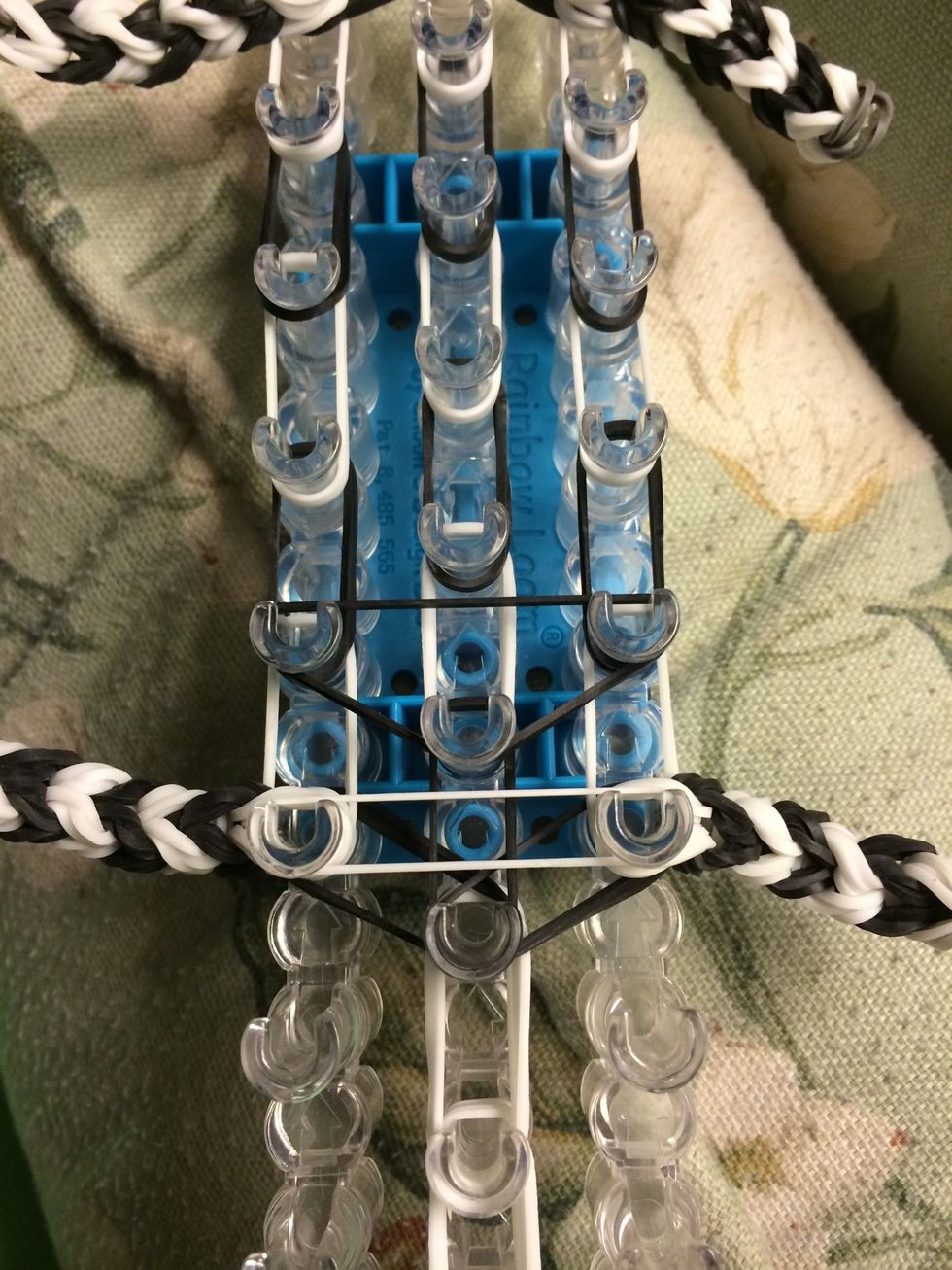 Take two black bands and make an upside down triangle