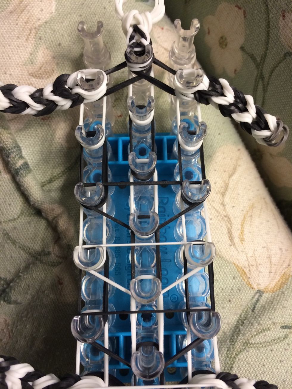 Take two black bands and make another upside down triangle