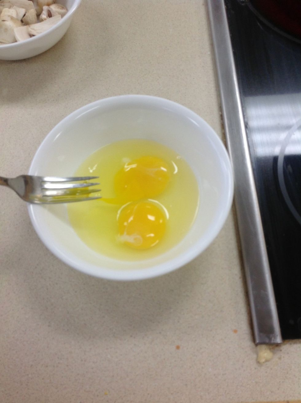 Take two eggs and scramble them.