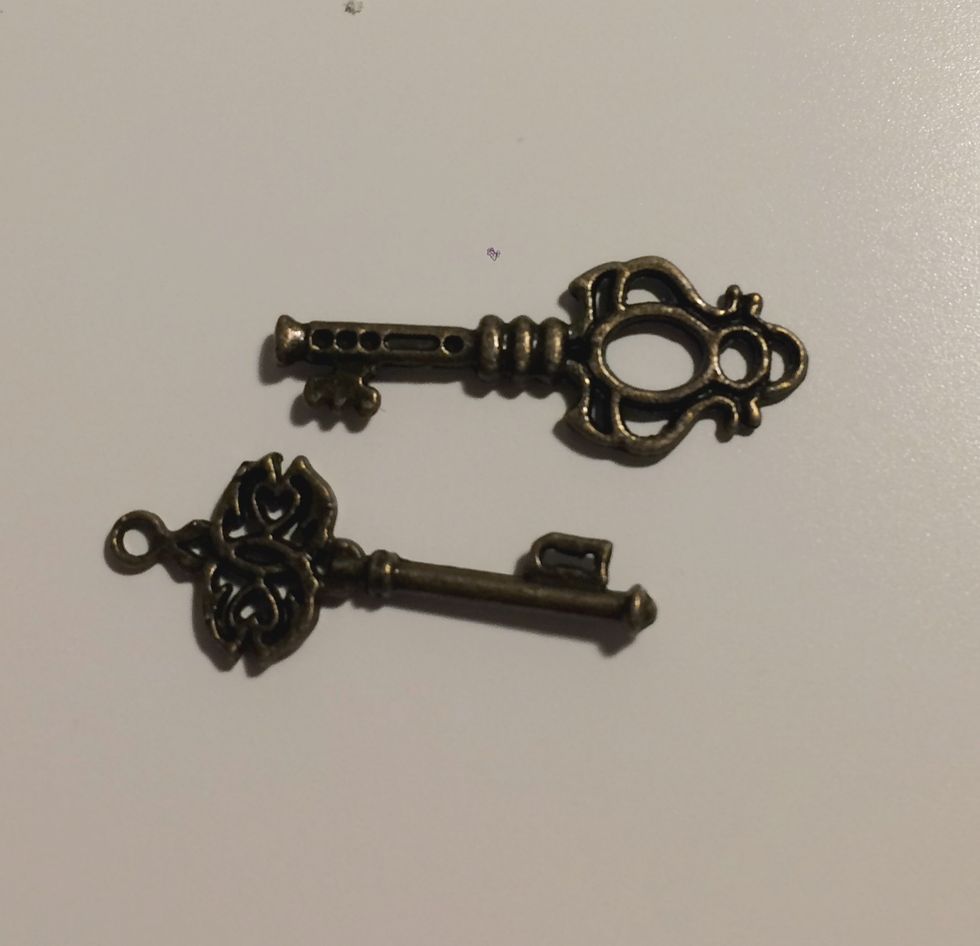 Take two keys out of the ornate metal key package.