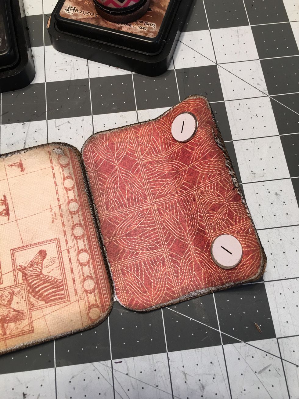 Take two Large Magnet Snaps (- Negative) and attach the magnet side to the area where the other two magnets are attached (magnets are hidden under the patterned paper).