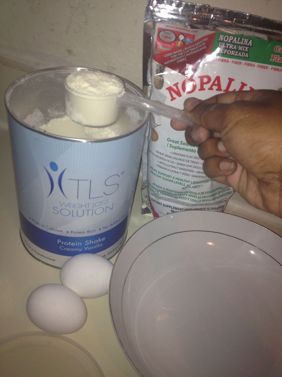 Take two large scoops of your vanilla protein shake, I'm using TLS protein shake that can be found on www.shop.com/reinamitzy