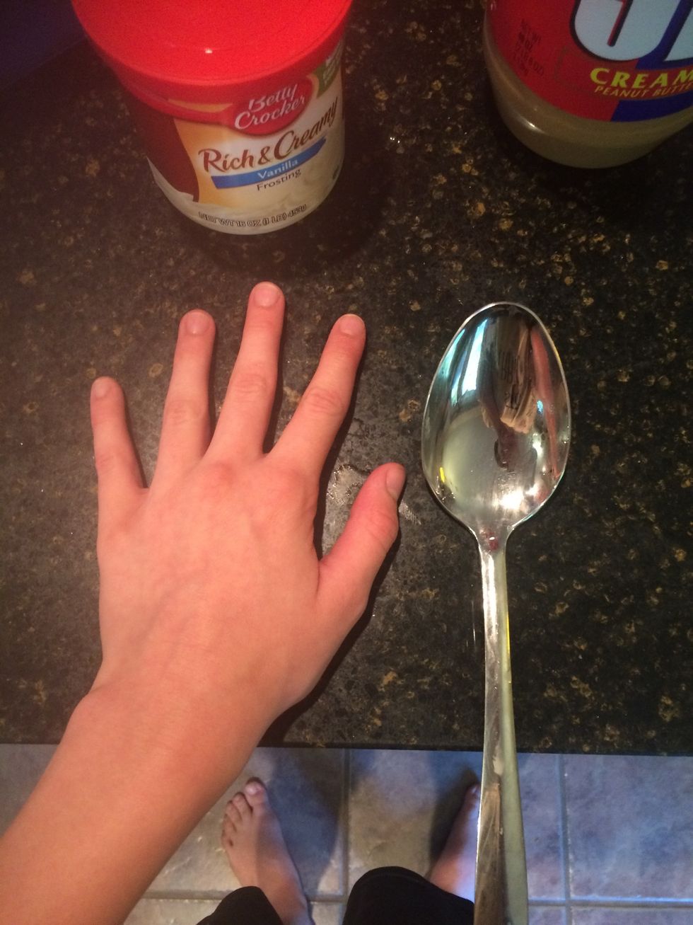 Take two spoon fulls of vanilla frosting and one spoon full of peanut butter and put them in a bowl