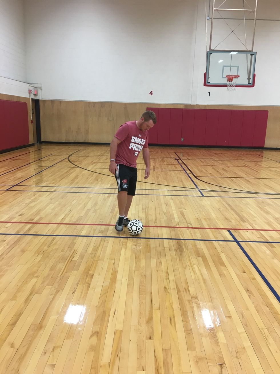 Take two steps forward and strike the ball with the inside of your foot. Look at the ball to ensure solid contact.