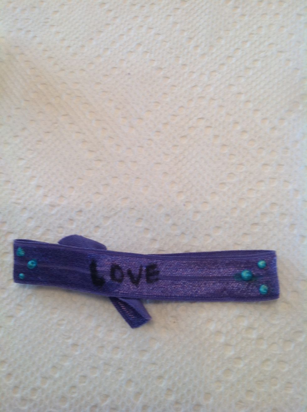 Take ur sharpie and write a word in the middle.