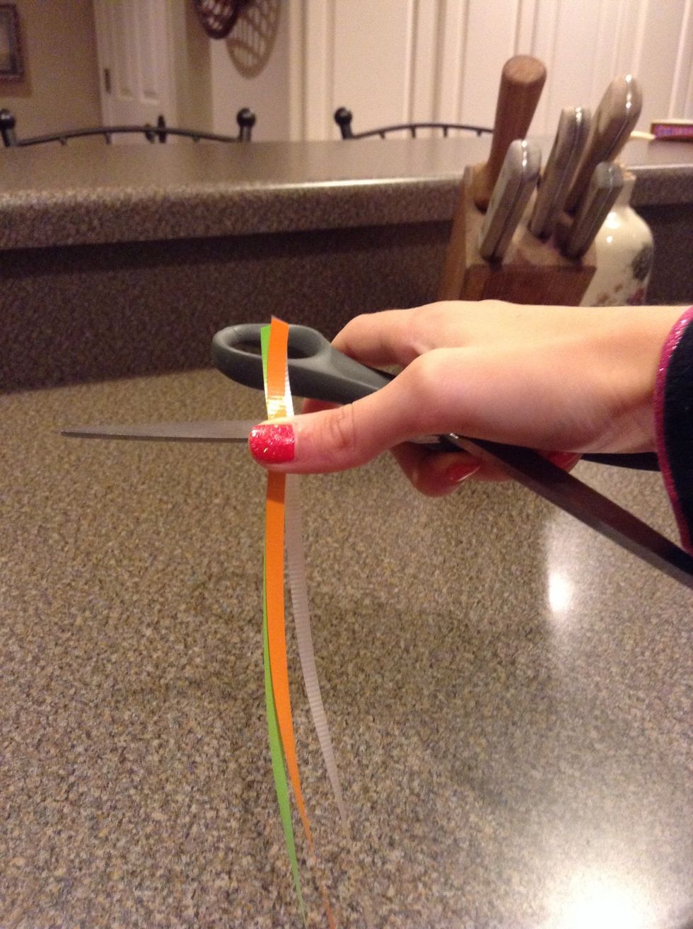 Take ur strings and scissors and put them like this