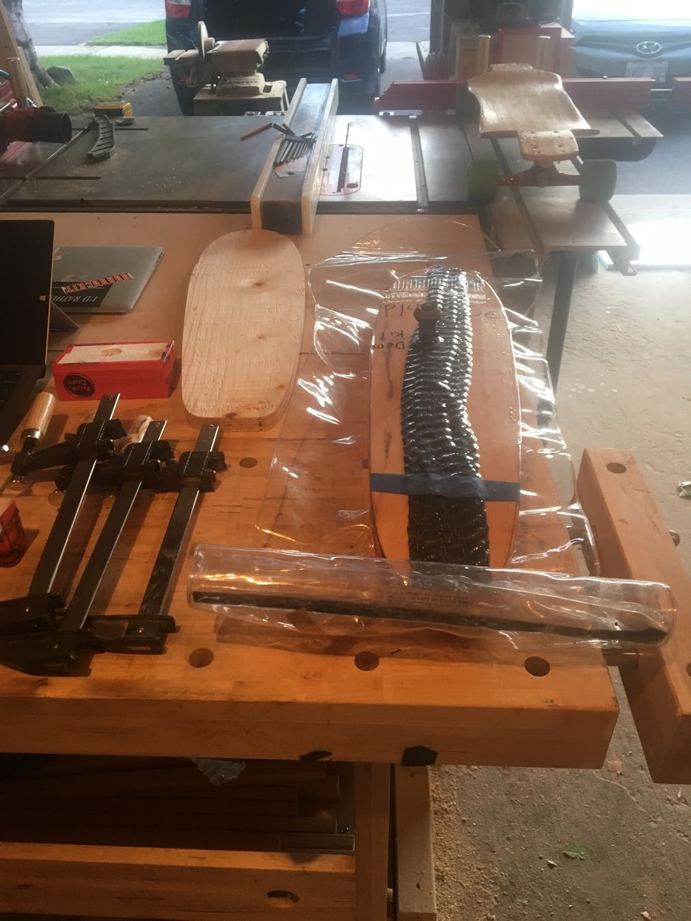 Take vacuum bag off plywood clamping base.