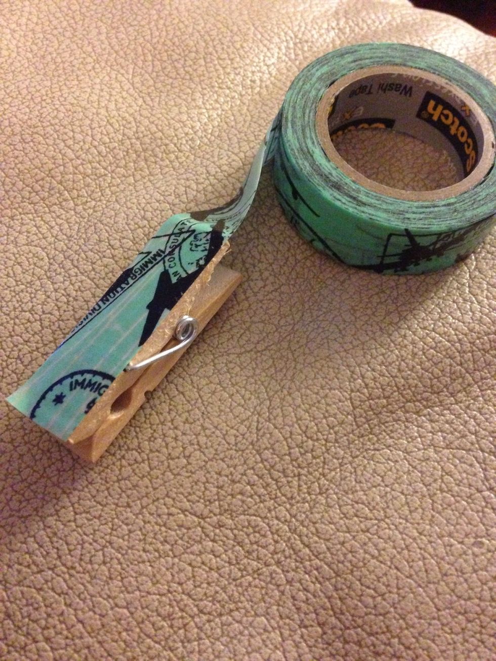 Take washi tape and place evenly covering the clothespin.