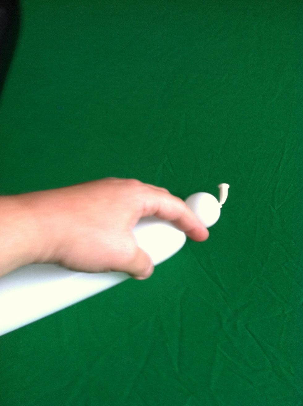 Take white balloon and twist off a small bubble