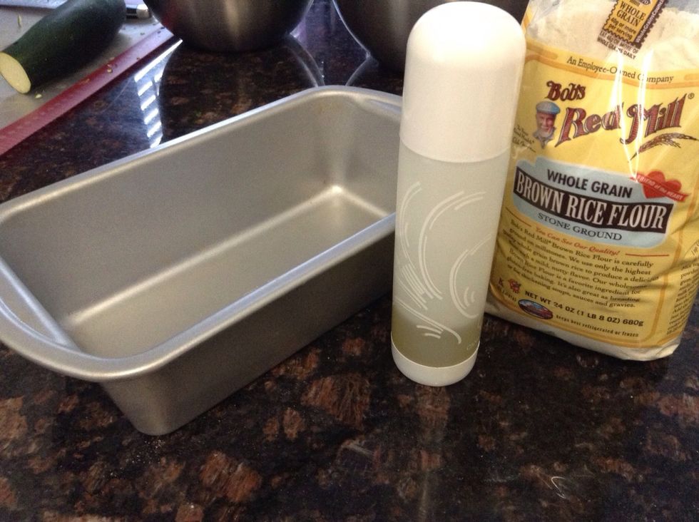 Take you loaf pan & prepare for baking by spraying with some non stick spray and dust with a little bit of the flour. This help prevent sticking to the pan.