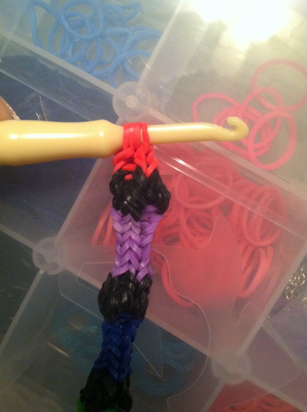 Take your bands off the loom by putting them on the loom tool, and attach all the band ends to the "c" clip.