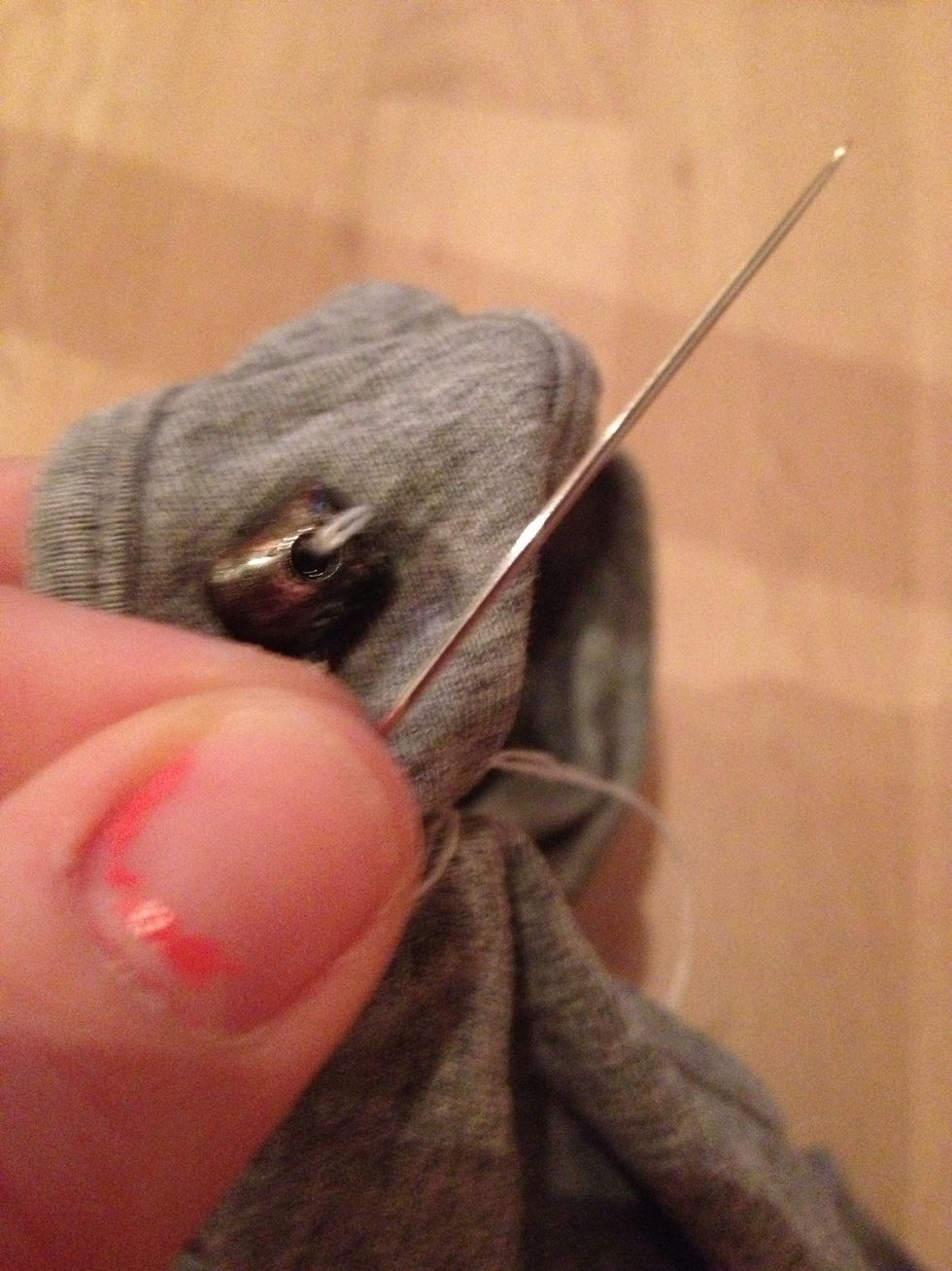 Take your beads and your needle, and start to sew it on!