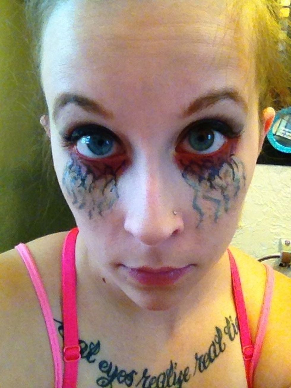 Take your black eyeliner and go back over the top part of your veins again to redefine them