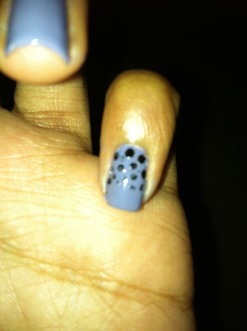 Take your black & make dots close to your cuticle & half way down your nail