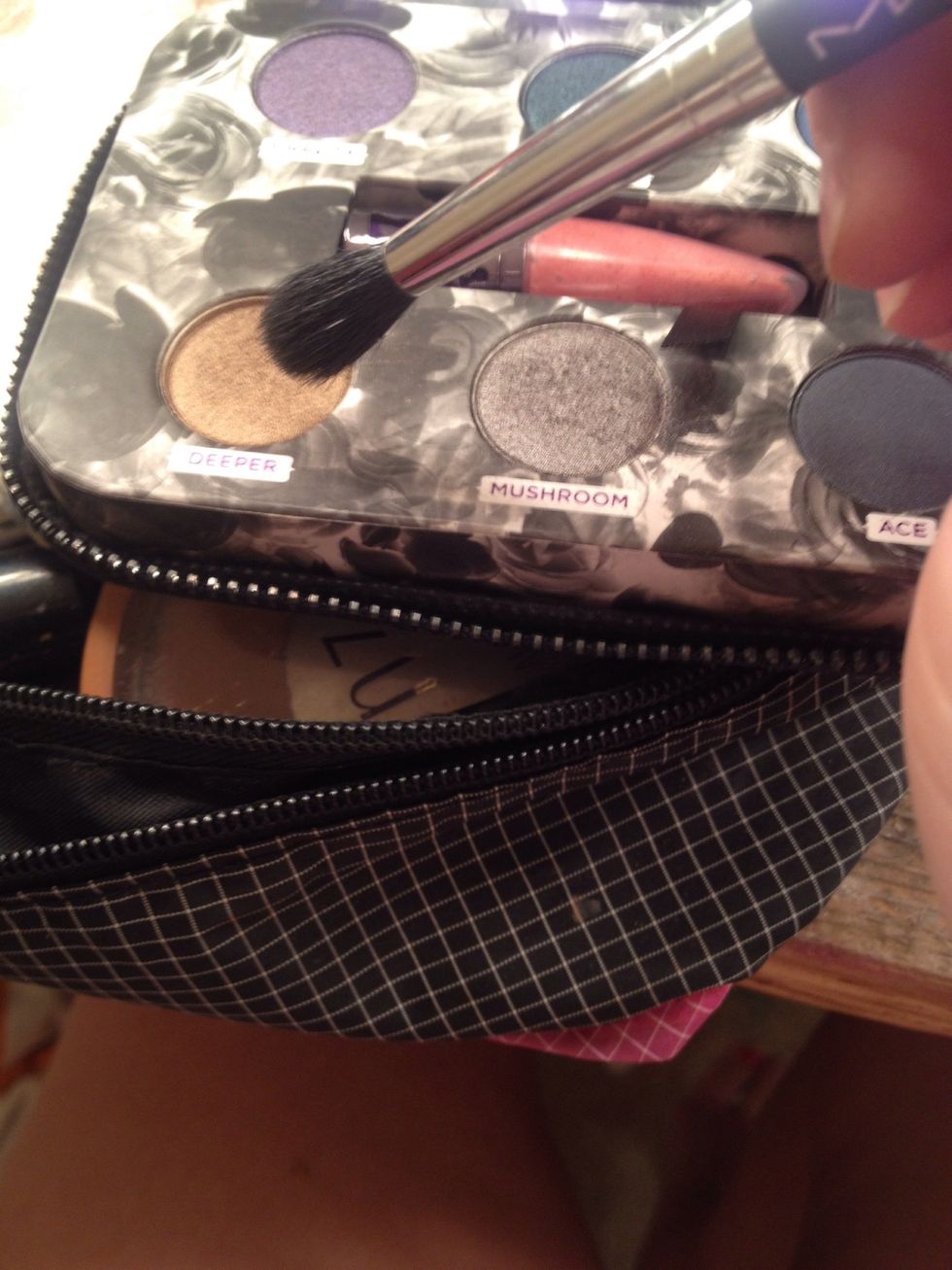 Take your blending brush in the deeper and tap it off