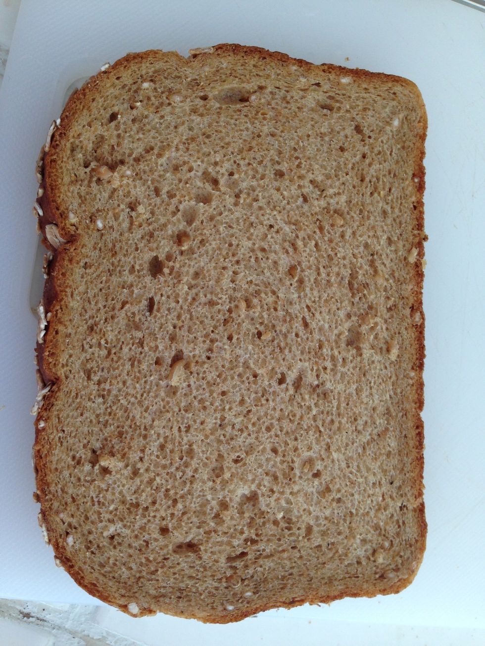 Take your bread and cut all corners so it's easier to fold your sandwiches. Use new baked bread for easier roll.