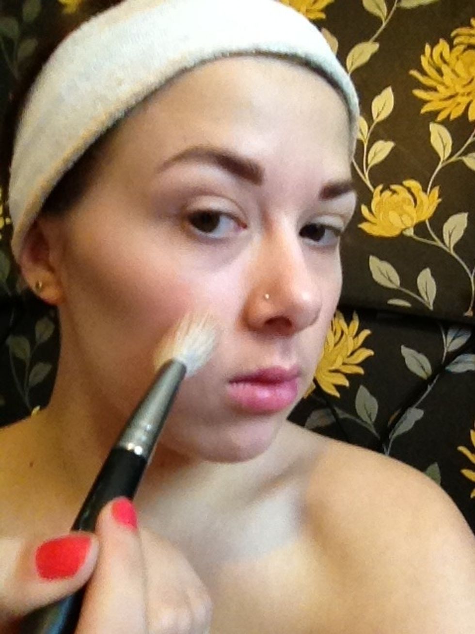 Take your brush and use your warm toned Contouring powder and apply lightly to the apples of the cheeks and upward towards the temples