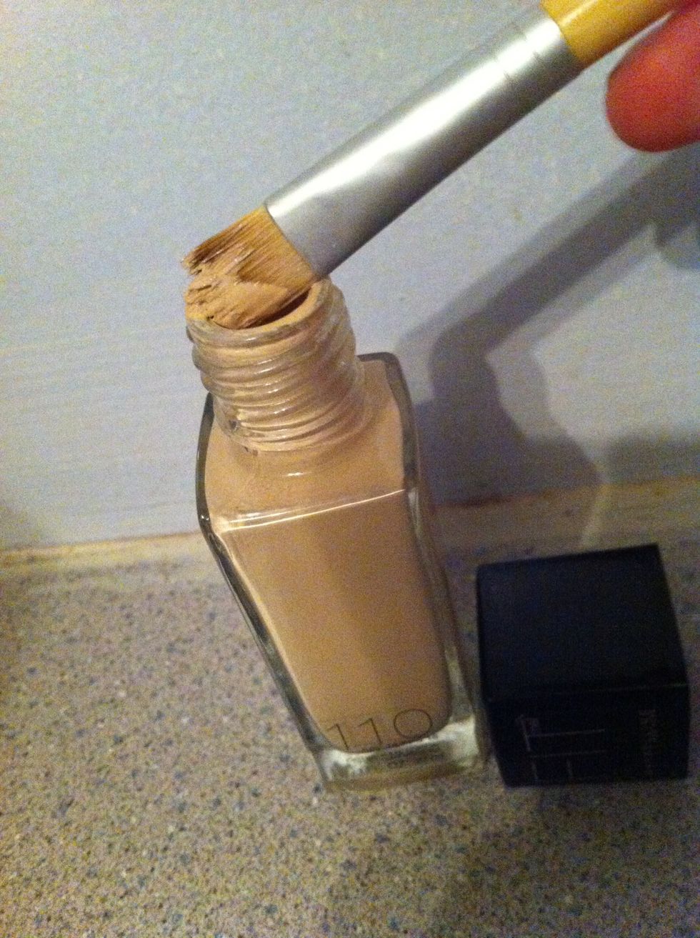 Take your brush (or finger) and dab on liquid foundation, onto your troublesome spot. Do not rub. Make sure you blend well around the spot, but not on it remember just dab.