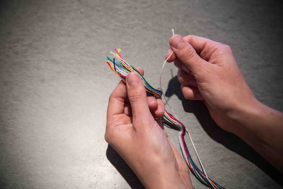 Take your bundle of embroidery floss and separate the color that matches your cut felt.