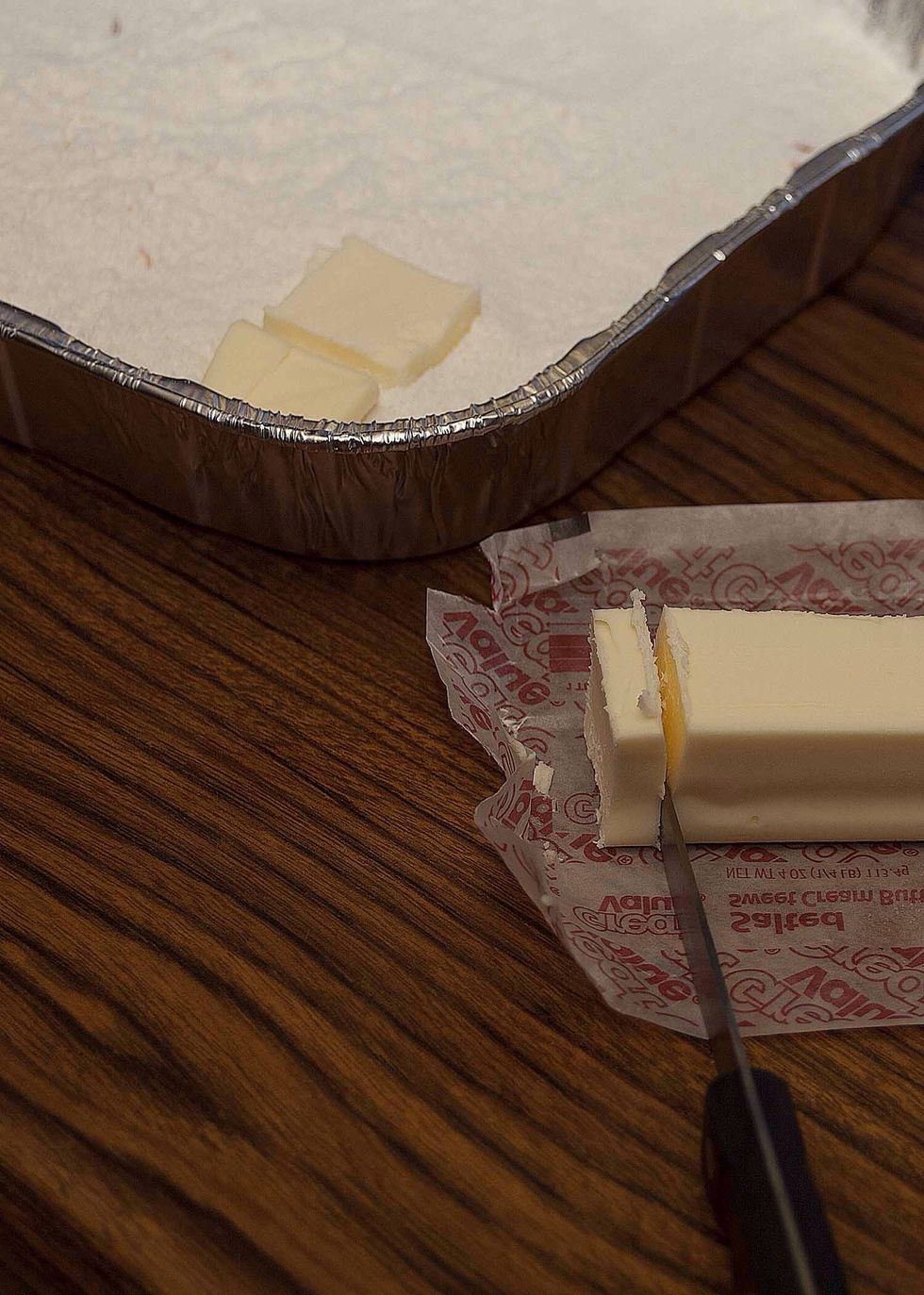 Take your butter out of the freezer and start slicing. Try to keep those slices around 1/4".