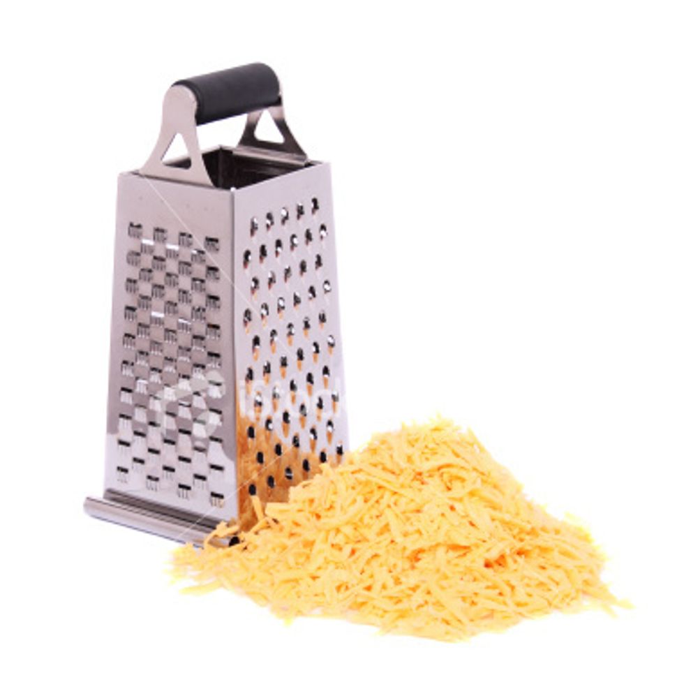 Take your cheese and shred your cheese blocks until they are gone and there's only little strips of cheese left. sprinkle the cheese evenly and if there is some cheese left EAT IT! or not