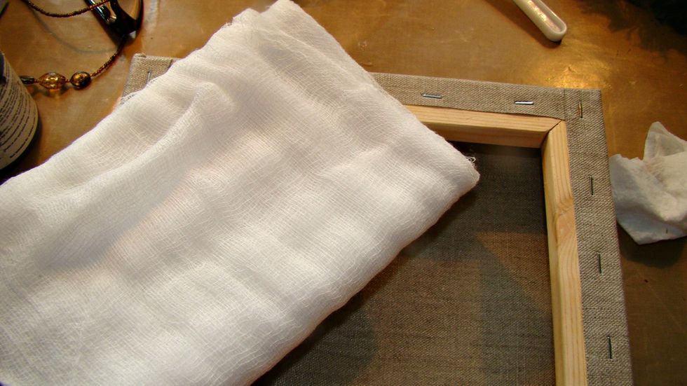 Take your cheese cloth and cover the outside randomly in chunks to provide texture using adhesive of choice.