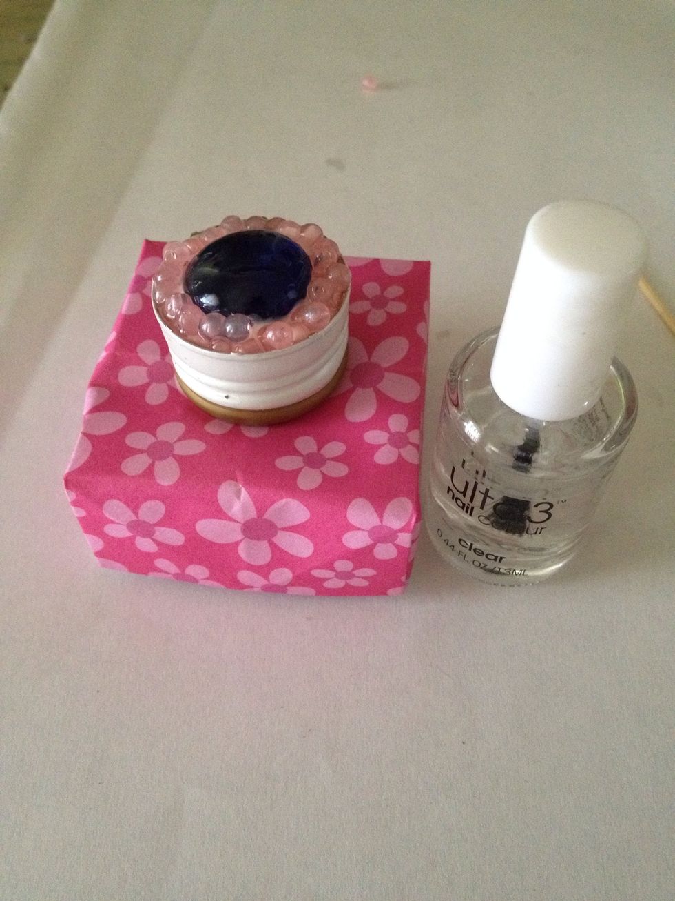 Take your clear nail polish again.