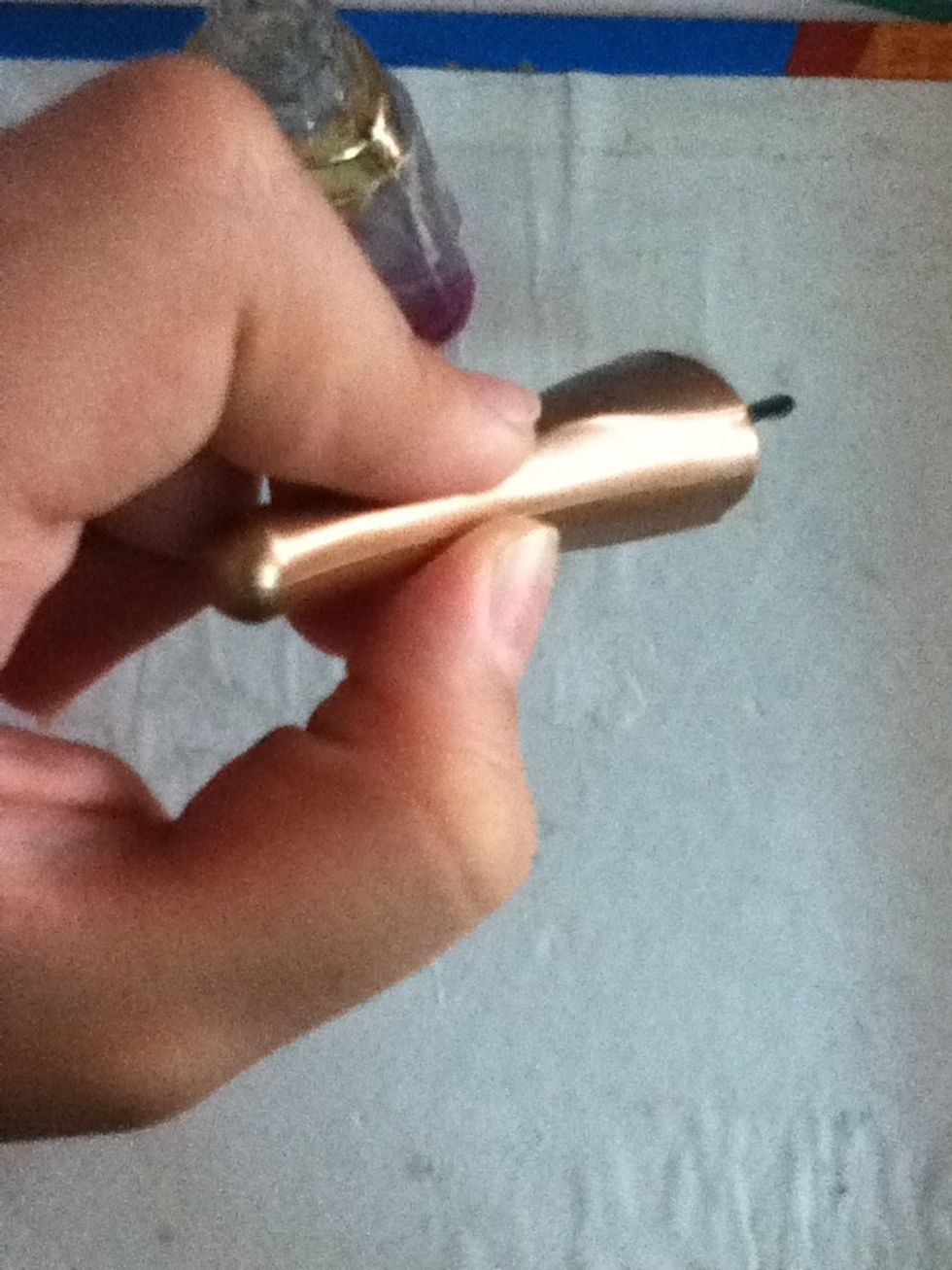 Take your clear polish and drop a little bit