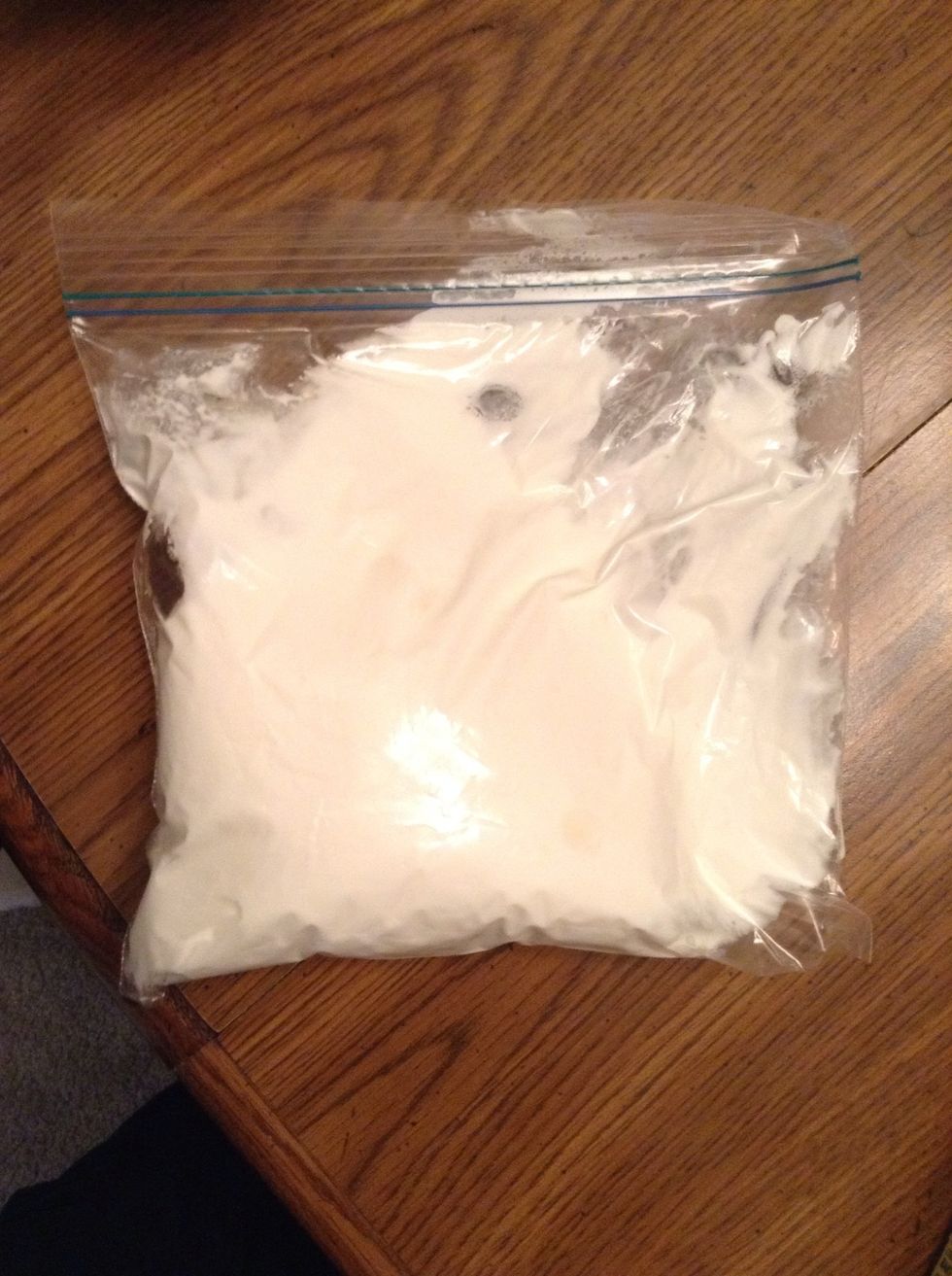 Take your Cool-Whip and add it into a Ziplock bag. Try to get the Cool Whip to one side.